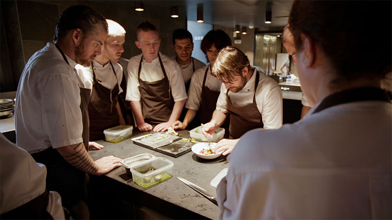 When chef René Redzepi and co-owner of the two-Michelin star restaurant Noma was frustrated by the institutional dictates requiring that servers wear suits and ties, he sent out his tattooed cooks to greet the restaurant’s customers. Where most elite Michelin restaurants offers and requires the use of silverware, he pushes his customers to eat with their hands. Foie gras is not on Noma’s menu; instead, there are ants and live shrimp.